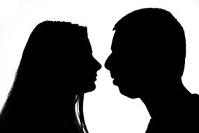 silhouette of a couple in love before a kiss