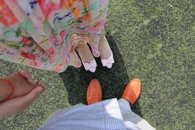 shoes on the feet of a couple in love