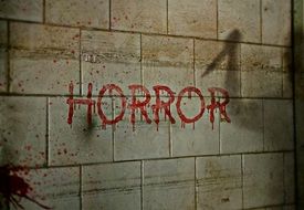 Horror, red lettering in tiled wall