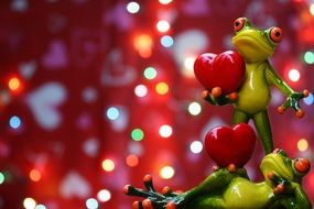 figures of green frogs to the Valentine's Day