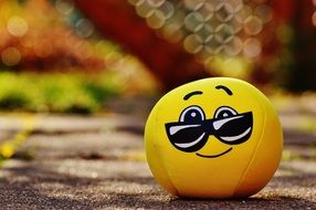 soft yellow smiley with glasses