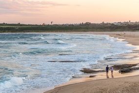 couple on the ocean beach in Australia, new south wales