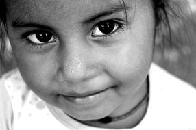 happy child's face with a smile close up