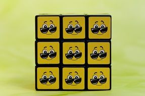 smiley glasses on a cube