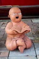 funny Buddha with glasses Stone Figure