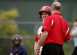 Softball, Coach talking to female Player