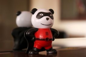 panda figure near the mirror