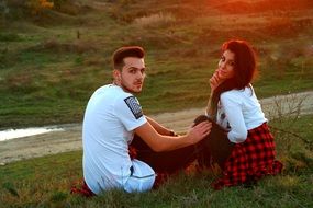 couple in love on the nature at sunset