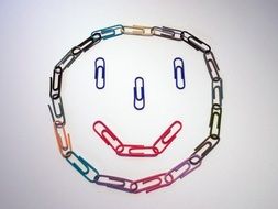 Smiley of colored paper clips