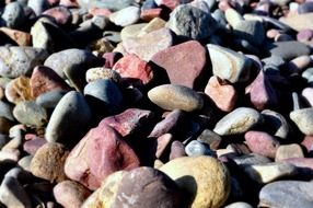 colorful pebbles at sunny day, background