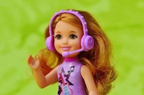 beautiful doll with purple headphones