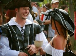 Male and Female Pirates, young people in costumes outdoor