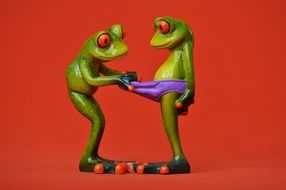 figures of funny curious frogs