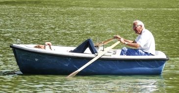 couple in a boat on the pond