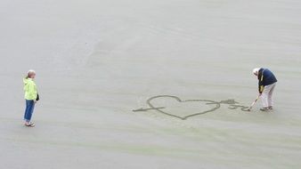 heart drawing on the beach