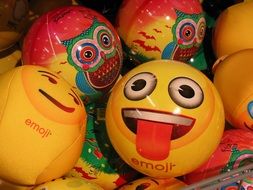 yellow ball with funny faces