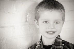 black and white picture of a cute young boy