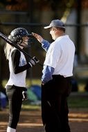 softball coach and player