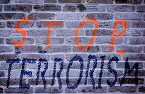 stop terrorism inscription on the wall