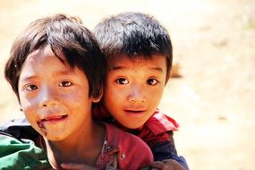 photo of two cheerful asian boys