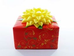 red gift with a yellow bow