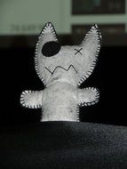 white plush mascot in the form of a cat
