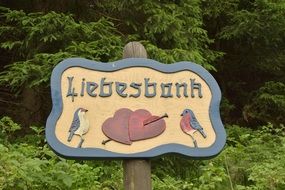 wooden sign with birds liebesbonr