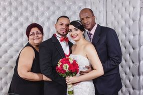 newlyweds with parents romance photo