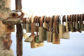 locks hang on a metal pipe