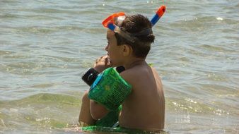 Picture of Kid Boy Playing in a sea