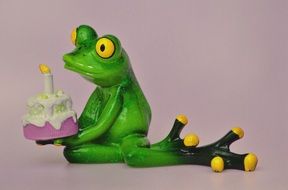 green ceramic frog with birthday cake