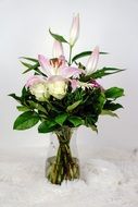 delicate flowers in a glass vase