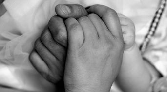 family handshake in black and white