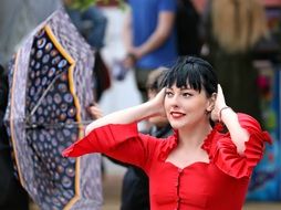 girl in a red dress with an umbrella