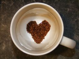 heart on a froth in a cup of coffee