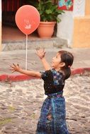 Girl with red balloon