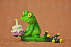 ceramic frog with birthday cake