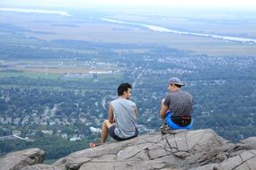 people on top of the cliff