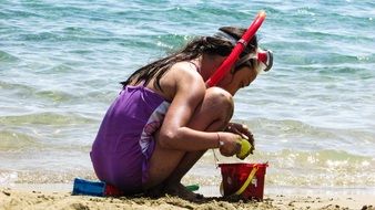 child girl on a sunny beach