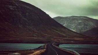 road among the river near the mountains on the landscape