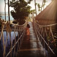 girl on a bridge on an exotic island