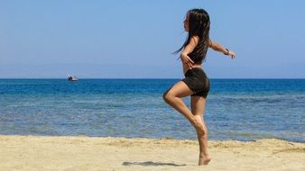 girl dancing on the beach