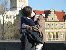 photo of a kissing couple on a bridge in Prague