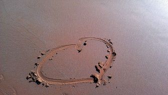 heart nerdvana on damp sand