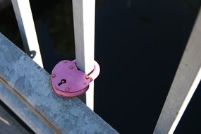 pink Love Lock on railing of Bridge