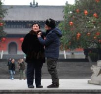elderly asian couple outdoors