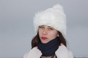 girl in a white hat and black scarf