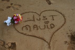 Just mauid, just Married, heart drawing with text on sand, usa, hawaii