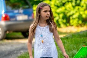 child outdoors on a summer day