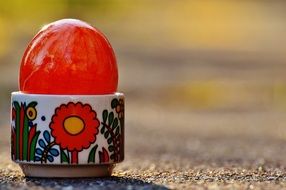 bright easter egg in the stand outdoors